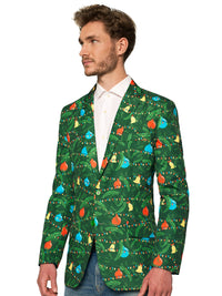 A man stands wearing the Suitmeister Christmas Green Tree Jacket Light Up, Blazer with light, which features vibrant holiday designs, paired with a white shirt, and jeans. He has short brown hair and a slight smile, with his hands by his sides against a white background. Close up.