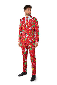 A man wearing the Suitmeister "Christmas Red Icons - Light Up" suit, featuring festive patterns of snowmen, snowflakes, and Christmas trees, is paired with a white shirt and red tie against a white background.