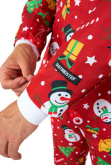 A man wearing the Suitmeister "Christmas Red Icons - Light Up" suit, featuring festive patterns of snowmen, snowflakes, and Christmas trees, is paired with a white shirt and red tie against a white background.