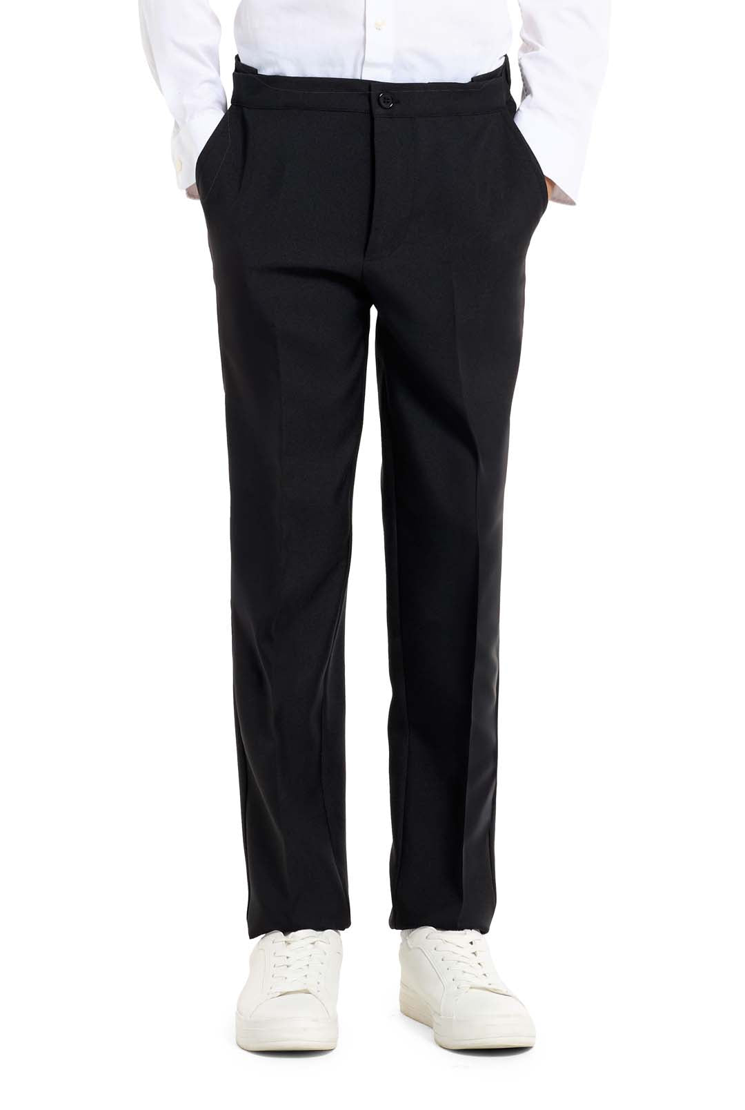 A young person with long hair, smiling, is wearing Suitmeisters Solid Black suit paired with a white shirt and black tie, standing against a white background.
