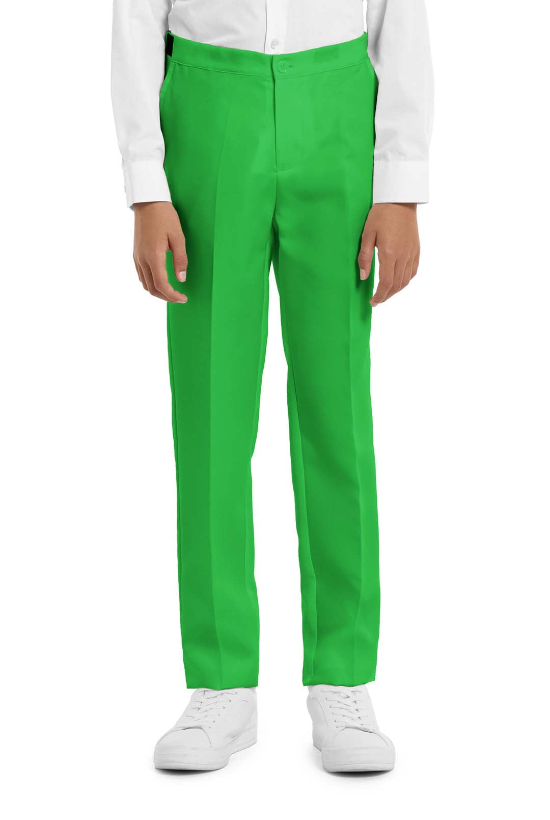 A young person with wavy hair smiles at the camera, wearing a Suitmeister Solid Green suit, white shirt, and green tie. They stand against a white background with one hand in their pocket.