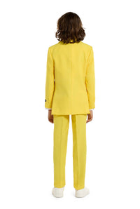 A child with a joyful expression and curly hair is wearing the Solid Yellow suit by Suitmeister, complete with a matching tie, set against a white background.