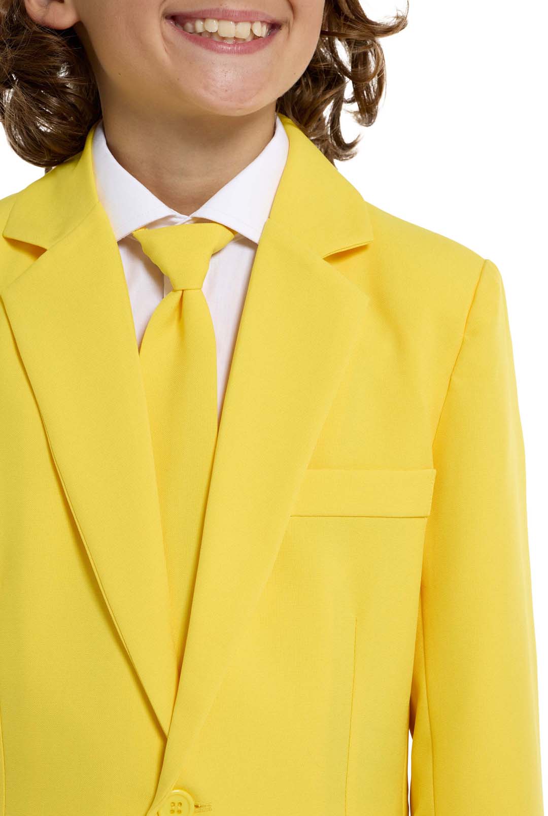 A child with a joyful expression and curly hair is wearing the Solid Yellow suit by Suitmeister, complete with a matching tie, set against a white background.