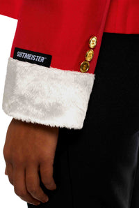A person is wearing the Santa Faux Fur jacket in red, featuring white faux fur cuffs and gold buttons. The sleeve displays the Suitmeister brand label. The hand is visible against black pants.
