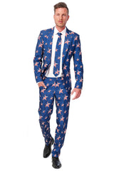 A man walks confidently wearing the Suitmeister USA Stars and Stripes suit, featuring a pattern of white stars and red stripes reminiscent of the American flag. He pairs it with a white shirt, matching tie, and black shoes.